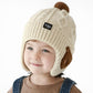 Stickade vintermössa med öronlappar